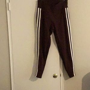 Athleta wine color jogger pants with stripe going down each side like new
